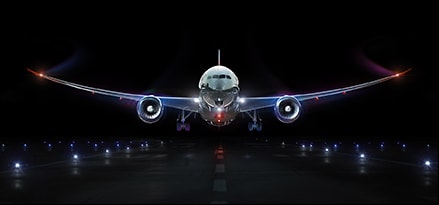 Boeing 787 plane landing at night