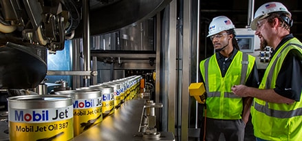 Engineers overseeing Mobil Jet oil production