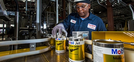 Exxonmobil engineer examining grease