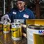 Exxonmobil engineer examining grease