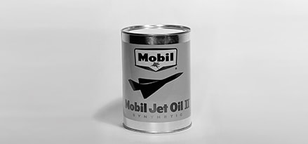 Can of Mobil jet oil in black and white