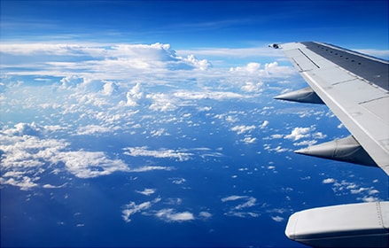 Blue sky view from the side of a plane
