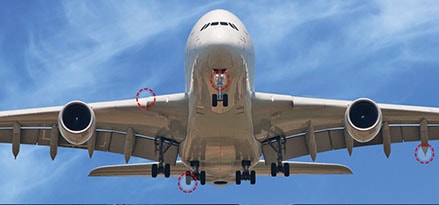 Flying airplane protected by ExxonMobil Aviation products from nose to tail