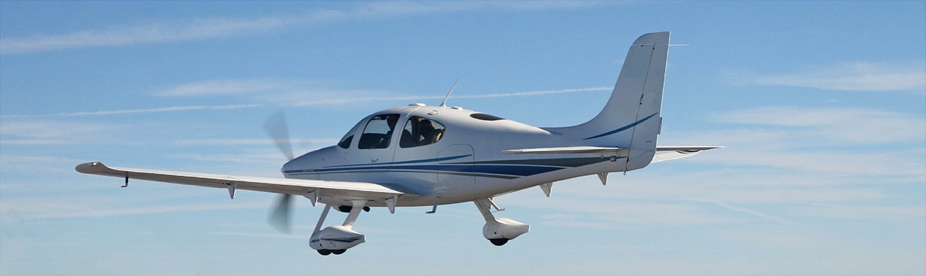 Single propeller plane flying over mountains Single propeller plane flying over mountains