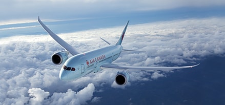 Air Canada in flight with blue sky