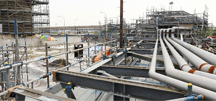 Construction crews working In the Singapore ExxonMobil refinery location.