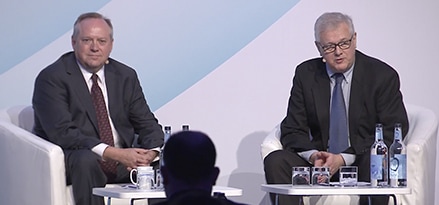 speakers sitting at a conference