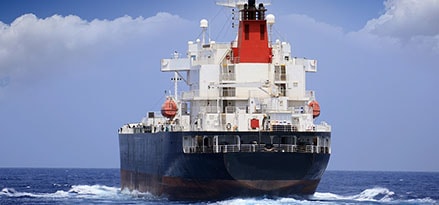 Bulk carrier ship viewed from behind ExxonMobil Marine