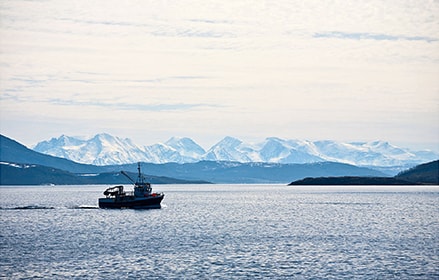 Ship with a mountain view in the distance