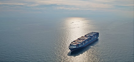 CMA CGM Titus container ship in the sunset