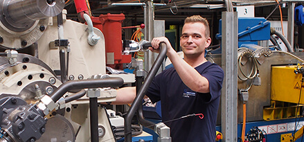 engineer next to machinery