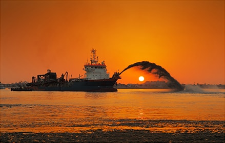 Fire fighting ship in the sunset