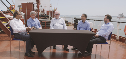 Group of people discussing lower emission fuels