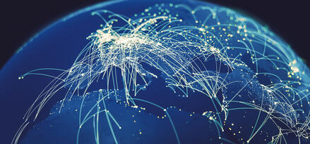 This image shows a digital representation of the Earth, focusing on Europe, parts of Africa, and the Middle East. Bright, glowing lines and points connect various locations, illustrating global connectivity, such as internet networks, airline routes, or data exchanges. The scene is stylized in shades of blue, with light lines and dots creating a sense of activity and communication across continents. The visual effect emphasizes the dense connections in Europe and surrounding regions, highlighting the importance of network infrastructure and worldwide interaction. No logos are present in the image.