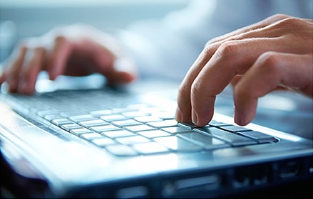 male hands at keyboard