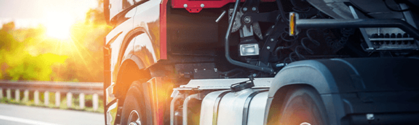 Truck driving on road in background